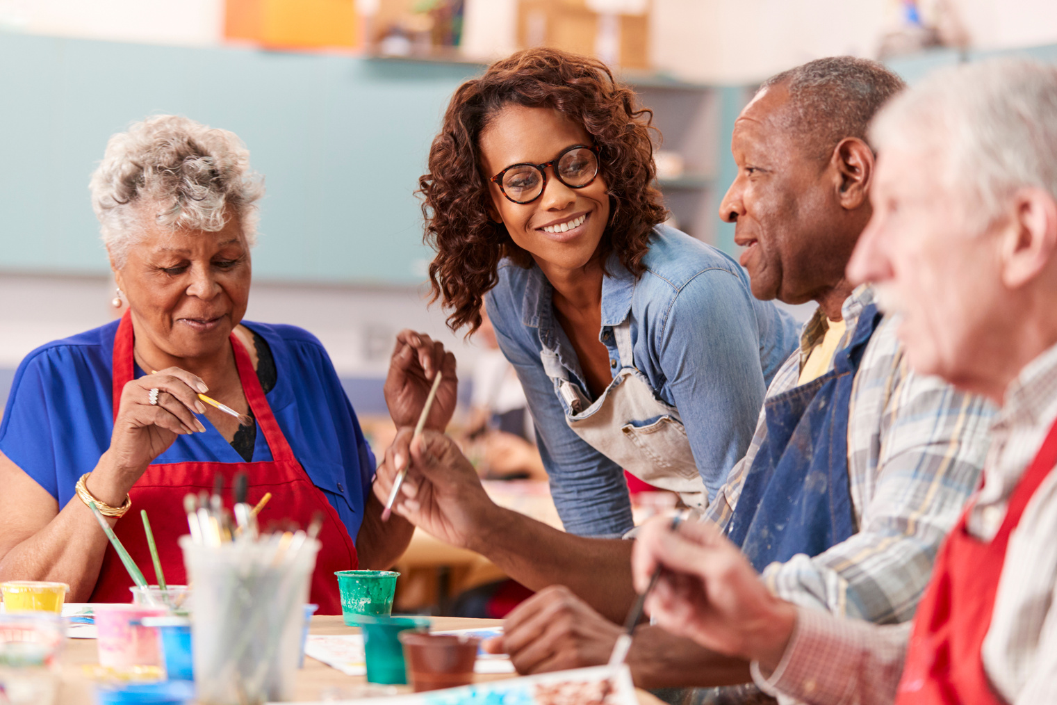 Group of Retired Seniors Attending Art Class in Community Centre